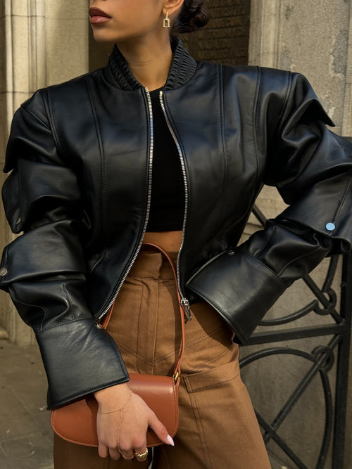 Details of the black bomber leather jacket